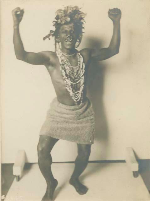 Studio portrait of man demonstrating war dance