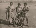 Group of four children with holding tools