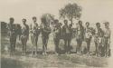 Group of women standing, many with babies