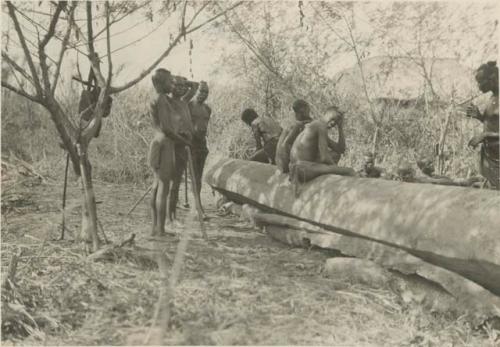 Group with dugout canoe