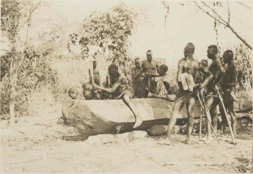 Group with dugout canoe