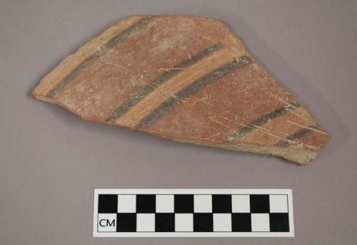 Ceramic body sherd with painted banding decoration on exterior