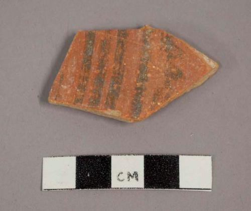 Ceramic body sherd with painted geometric design on exterior