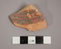 Ceramic body sherd with painted geometric design on exterior