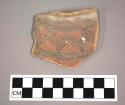 Ceramic rim sherd, curved with painted geometric design on exterior