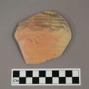 Ceramic rim sherd, curved with painted geometric design on exterior