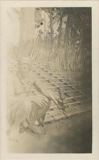 Man constructing a roof