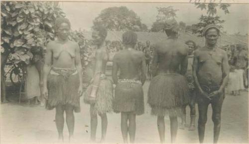 Bulu women with grass skirts