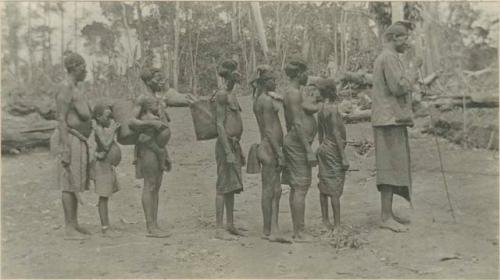 Headman and wives escorting his daughter to her marriage