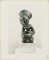 Kneeling figure with bowl