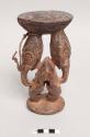 Betel nut mortar with base of male and female figures