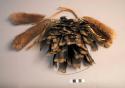 Tobacco net decorated with fur, feathers and cocoon (hanom su)