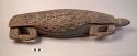Wooden pillow or head-rest in the form of a turtle, curvilinear motifs carved on