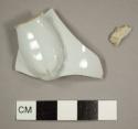 European porcelain handle base sherd with light blue/gray glaze and body sherd fragment