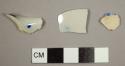 Pearlware sherds with blue and white decorations, including one rim sherd possibly from a chamber pot