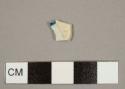 Pearlware sherd with blue-on-white decoration on one side