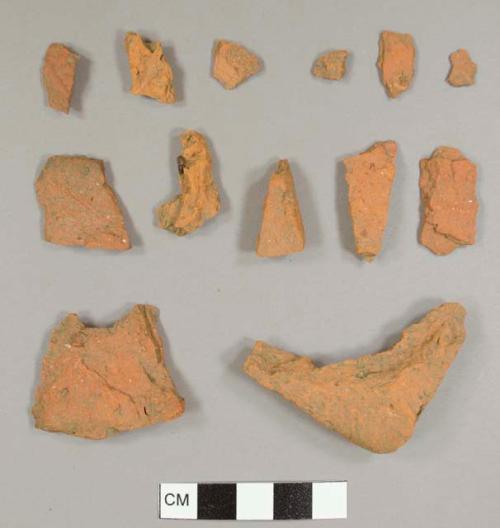 Handmade brick fragments, dark red-orange color