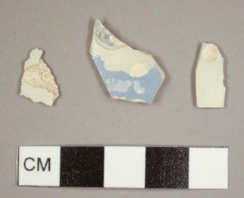 Light blue annular ware sherd with possible attachment from a mug and two pearlware sherds