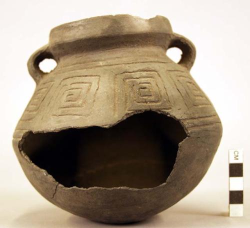 Badly broken incised black stirrup pot