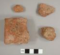 Dark red brick fragments, possibly handmade