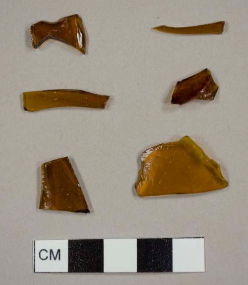 Amber curved glass fragments