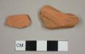 Unglazed red earthenware sherds, possibly from a flower pot