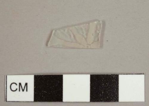 Colorless flat glass fragment with frosted/molded flower decoration on one side