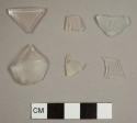 Curved glass fragments, including one rim to a hollowware vessel with a 10 cm diameter