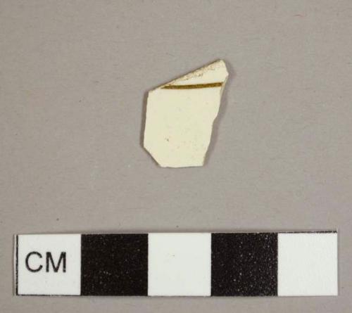 Creamware sherd with a brown transfer print line