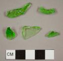 Machine-made green bottle glass fragments, one rectangular, one possible mouth sherd, and one with "RE" embossed on the exterior