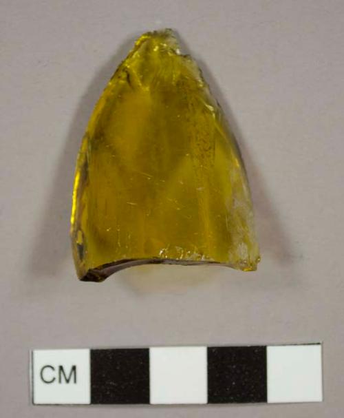 Yellow-brown bottle glass fragment