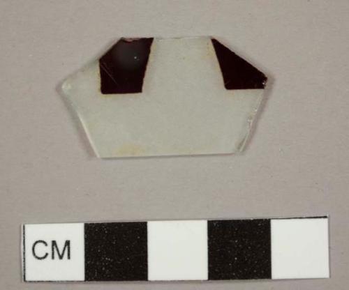 Frosted colorless flat glass fragment with red decorations