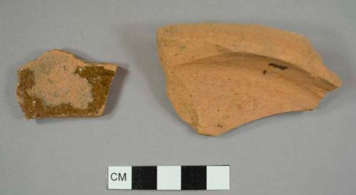 Lead-glazed red earthenware sherds, including one base fragment of a hollowware vessel