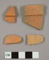 Unglazed red earthenware sherds, including two flower pot rims