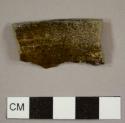 Lead-glazed, burned earthenware bowl rim sherd with a 20 cm diameter