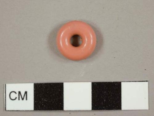 Puce plastic donut or bead