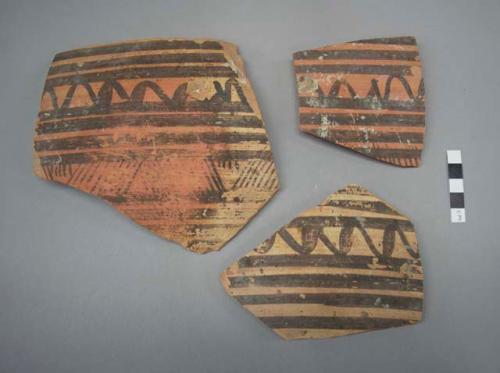 Painted potsherds- Jhukar painted, pink paste, cream slip, black paint