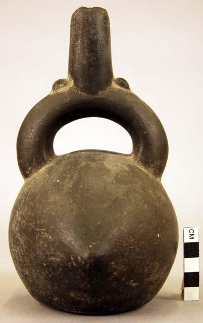 Stirrup vessel, globular, with one pointed side and one flattened side