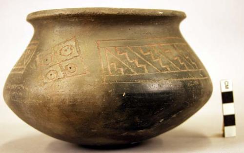 Ceramic jar, flaring rim, red on black incised geometric design