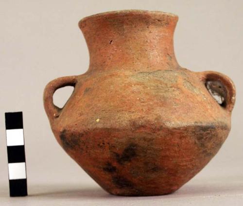 Small plain red pottery jar, dimpled base & 2 handles