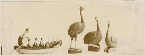 Figurines of men in ferry, and birds