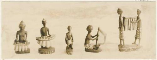 Figurines of drummers and part of a funeral