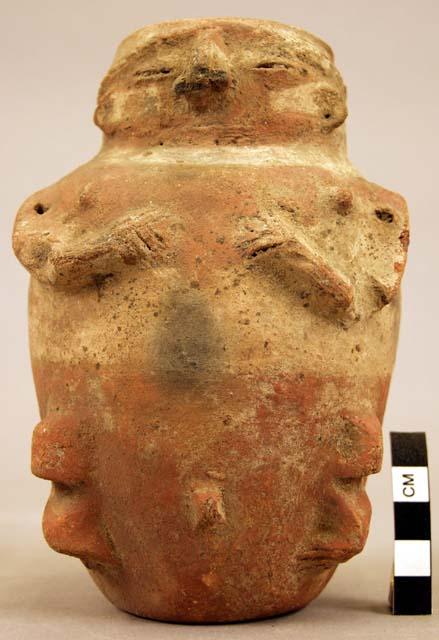 Terra cotta vase, grotesque human form