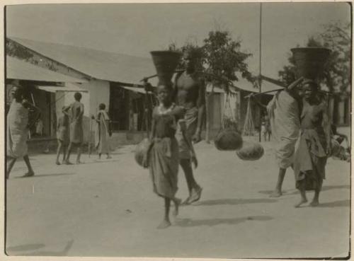 People carrying goods to market