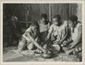 Group of women with wooden bowl