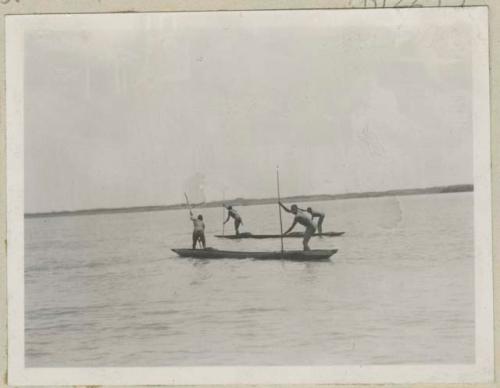 Fishermen going out in boats to pull up nets