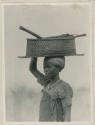 Woman carrying a basket