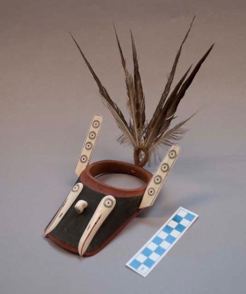 Visor model, man's kayak hunting cap. Ivory walrus and 2 gull head effigies.