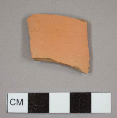 Unglazed, refined red earthenware sherd, possibly from a flower pot