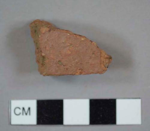 Coarse red earthenware sherd, most likely from a drain pipe